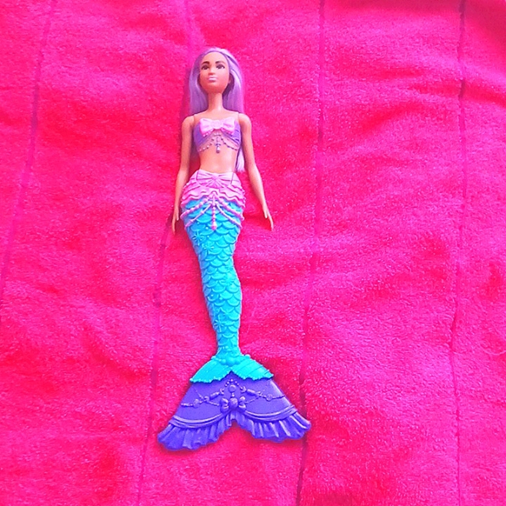 I am selling a mermaid Barbie doll.